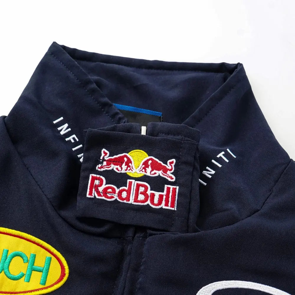 Close-up of navy streetwear jacket with Red Bull logo patch and embroidered racing details