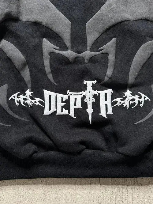 Black oversized hoodie with bold gothic 'DEPTH' print and abstract streetwear design.